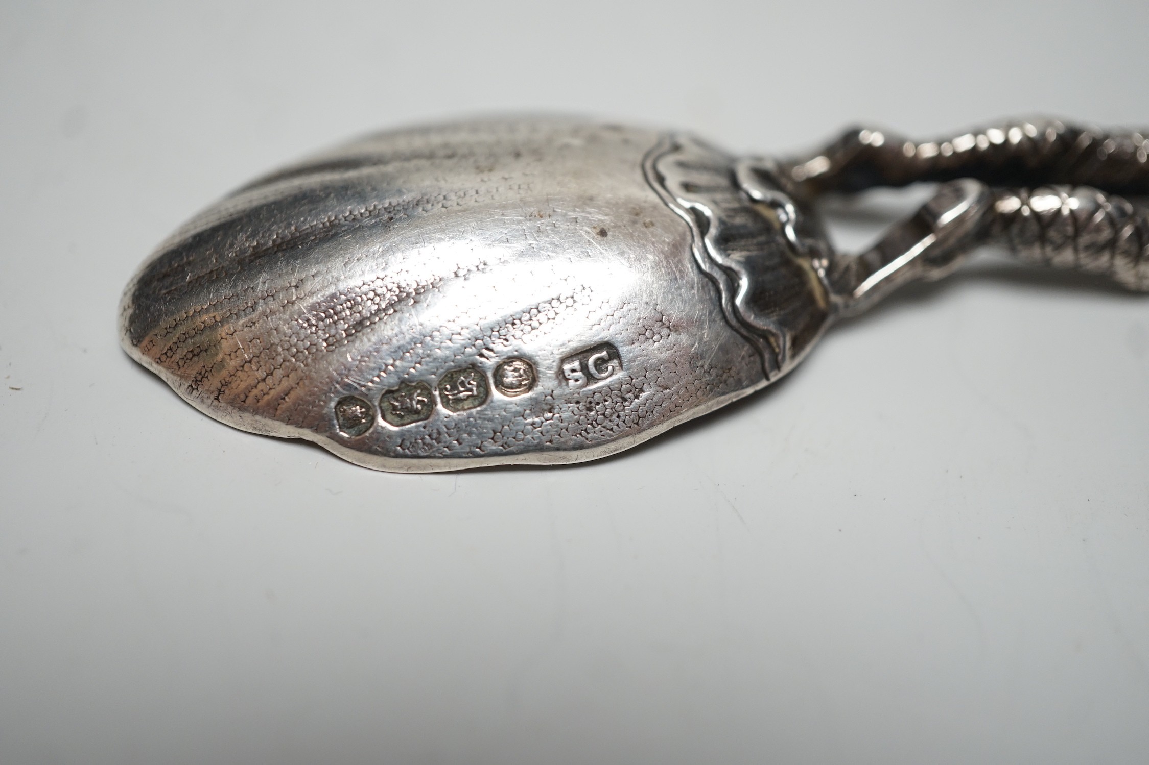 An early Victorian novelty silver caddy? spoon, with figural stem, Susanna Cook, London, 1845, 11.6cm.